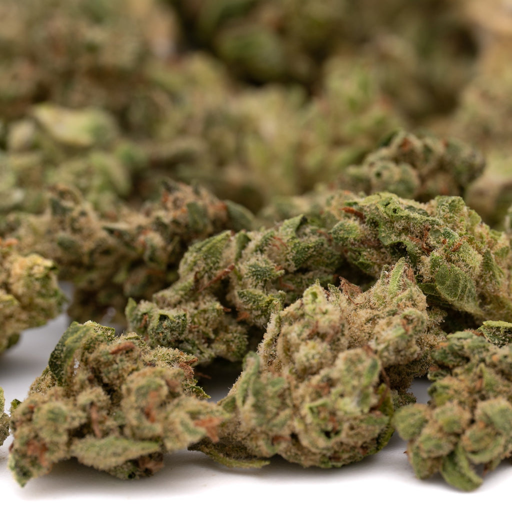 Lucky Charms THCa hemp flower smalls with green buds and white trichomes